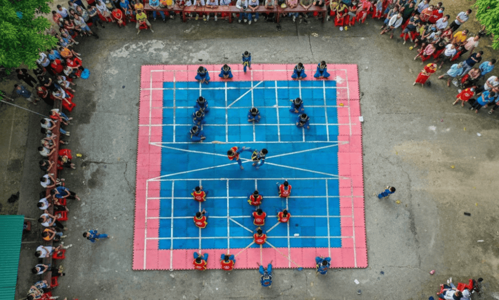 Real people take on the roles of giant chess pieces in a life-sized match full of drama and flair